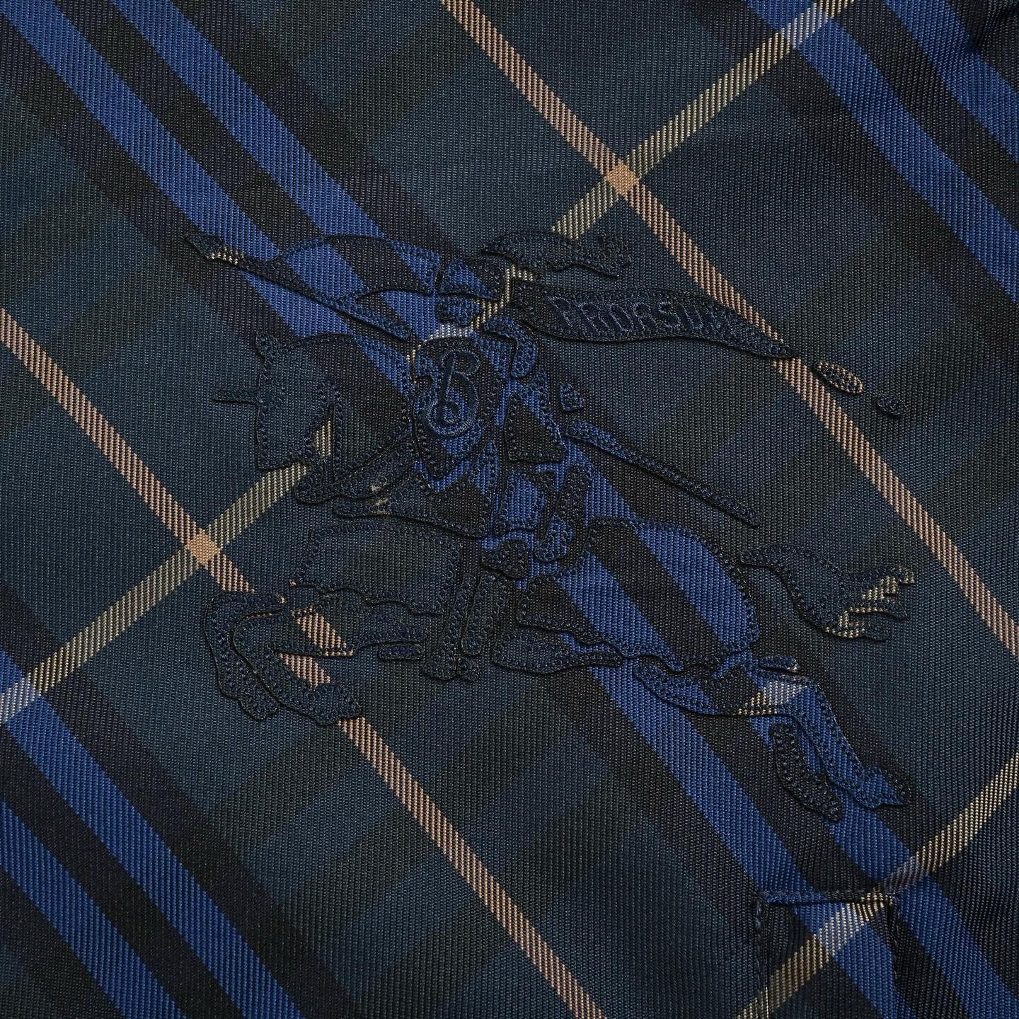 Burberry Checked Windbreaker In Blue
